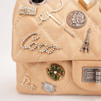 Chanel Reissue Lucky Charms Mini in Pelle di Vitello Beige con Catena e Charm