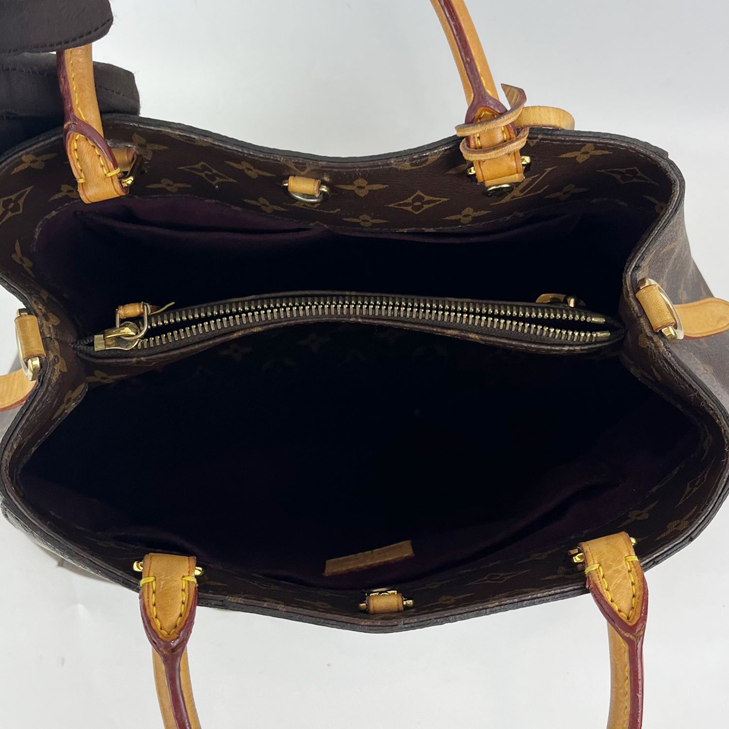 Borsa Louis Vuitton Montaigne MM in Tela Monogram Marrone con Manici in Pelle