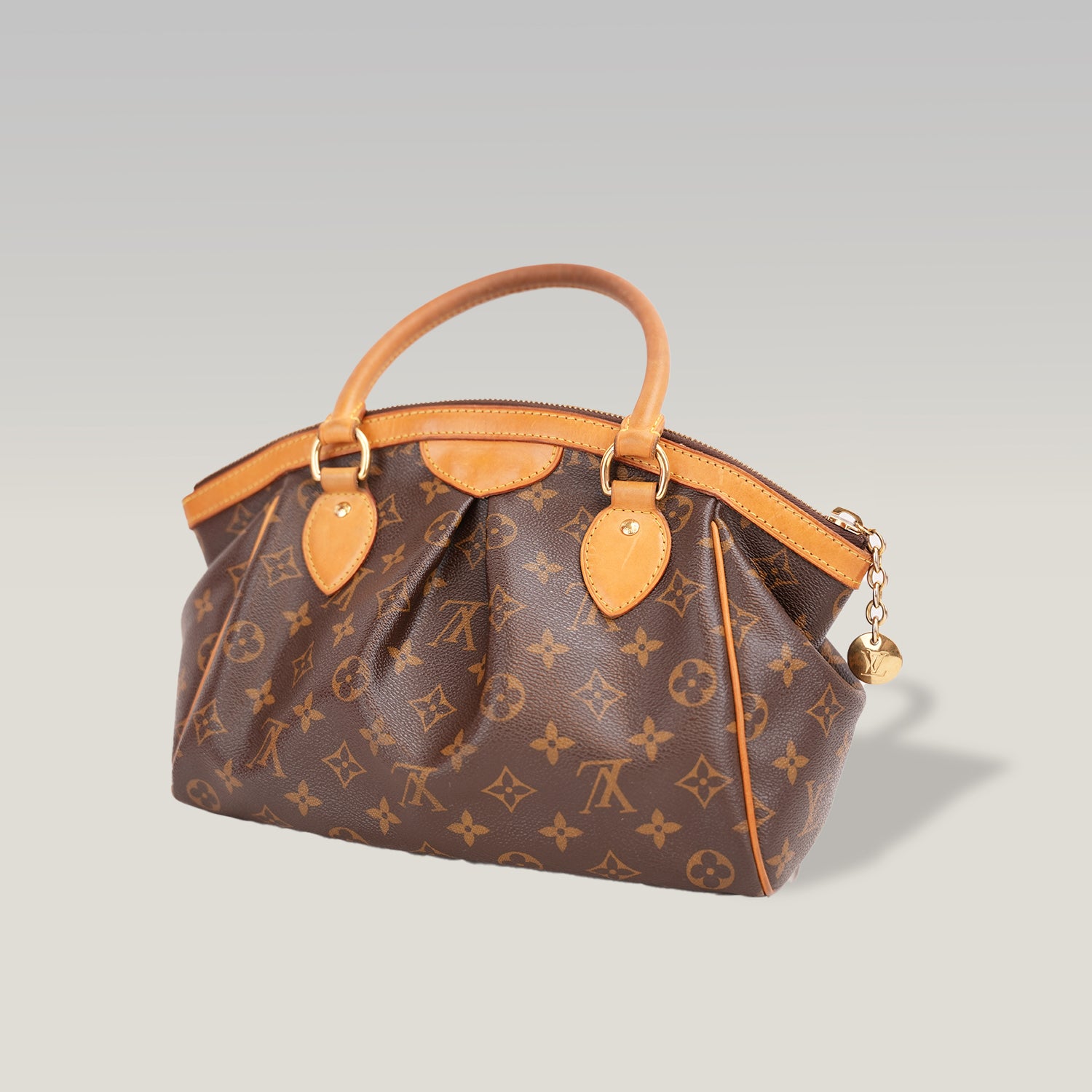 Louis Vuitton Tivoli PM Monogram – Borsa a Mano in Tela Marrone e Pelle Vachetta